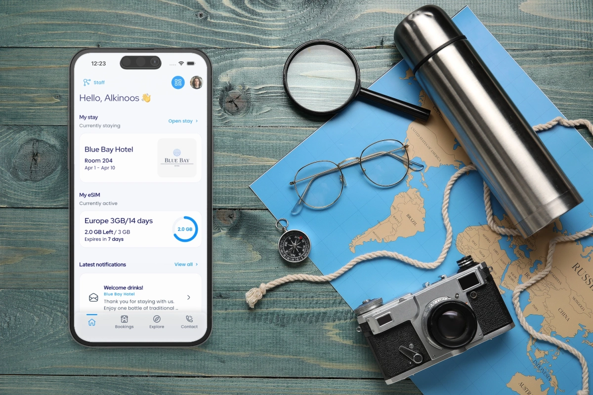 Phone running Conit Cloud travel app alongside map